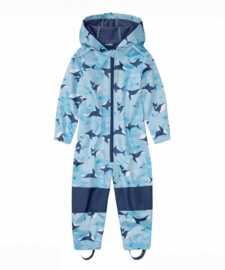 Combinaison de ski enfant avec motif de baleines et élastique pour les pieds sur fond blanc